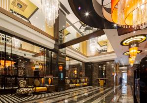 a lobby of a building with a chandelier at APA Hotel Yodoyabashi Kitahama Ekimae in Osaka +37 photos