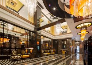 a lobby of a building with a chandelier at APA Hotel Yodoyabashi Kitahama Ekimae in Osaka