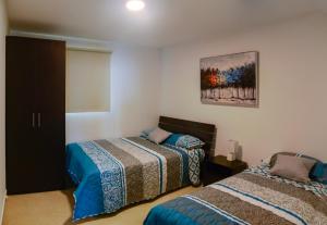 Una cama o camas en una habitación de Lindo Departamento al pie de playa Edificio TORRE OCEÁNICA 29 fotos más
