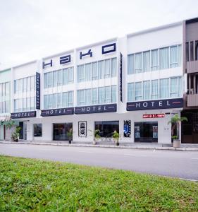 a building with a hotel on the side of a street at Hako Hotel in Skudai