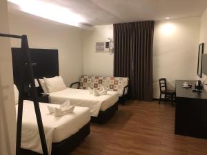 Postel nebo postele na pokoji v ubytování Piña Suites