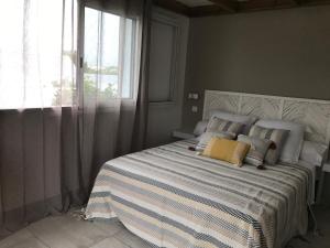 Postel nebo postele na pokoji v ubytování Bras-Panon: Maison avec vue et piscine 1-4 pers.