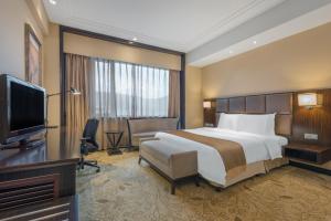 TV a/nebo společenská místnost v ubytování Holiday Inn Mudanjiang by IHG