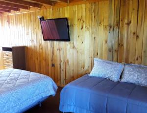 Voodi või voodid majutusasutuse Hostal Doña Tamy toas