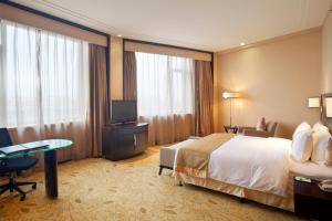 Postel nebo postele na pokoji v ubytování Holiday Inn Mudanjiang by IHG
