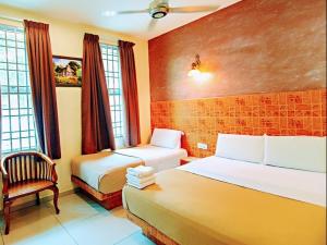 Säng eller sängar i ett rum på Hotel Seri Nilai