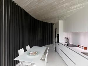 a kitchen with a white table and white chairs at CAEaCLAVELES in La Pereda de Llanes +81 photos