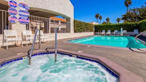 a swimming pool in the middle of a resort at SureStay Hotel by Best Western Camarillo in Camarillo