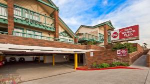 a hotel with a best western kills sign in front of it at Best Western Plus Dana Point Inn-by-the-Sea in Dana Point
