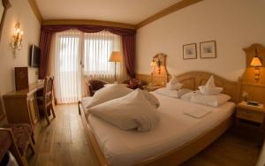 Postel nebo postele na pokoji v ubytování Hotel Bergland