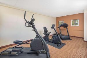 a gym with three exercise bikes in a room at Budget Inn & Suite Atlanta Marietta Stadium in Marietta