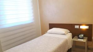 Postel nebo postele na pokoji v ubytování Hotel San Giorgio