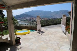 a patio with a yellow frisbee on top of it at Nijona 1 in Trebinje