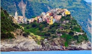 a small town on a hill on the water at Casa Belsito in Corniglia