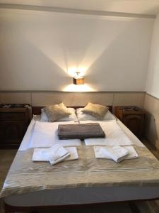 Postel nebo postele na pokoji v ubytování Mosoly Apartman