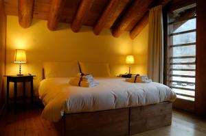 Postel nebo postele na pokoji v ubytování Pietre Gemelle Resort