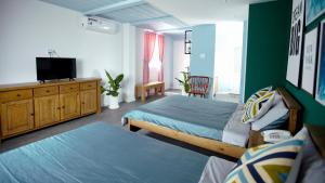 Postel nebo postele na pokoji v ubytování Sleep Box Hostel Phú Quốc