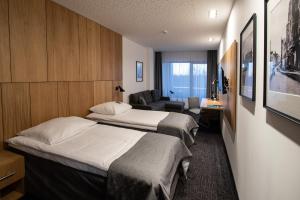 Postel nebo postele na pokoji v ubytování Hotel Olimp Business & Spa