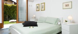 A bed or beds in a room at La Casa di Linda
