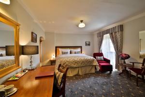 Rúm í herbergi á Questenberg Hotel