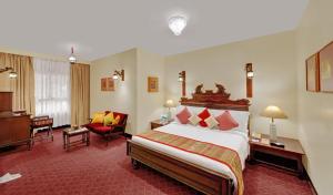 Postel nebo postele na pokoji v ubytování Ambassador Pallava