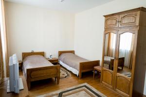Кровать или кровати в номере Гостиничный Комплекс Каменюки