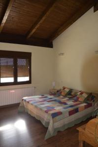 Postel nebo postele na pokoji v ubytování Casa Rural Alada