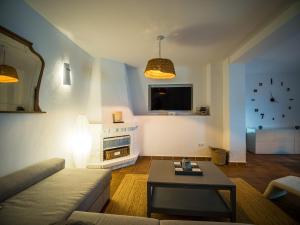 a living room with a couch and a table at Casa Carmen Altea with Terrace in Altea