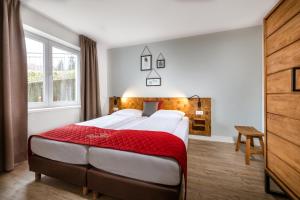 Postel nebo postele na pokoji v ubytování AlpenParks Residence Bad Hofgastein - gratis Thermeneintritt