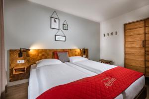 Postel nebo postele na pokoji v ubytování AlpenParks Residence Bad Hofgastein - gratis Thermeneintritt