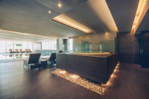 a living room with a sink and a fireplace at Iberostar Selection Lagos Algarve in Lagos
