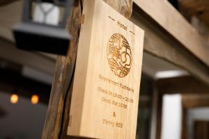 a wooden box with a label on it at Kyono Mori Yurinsha in Kyoto