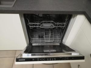 Kuchyň nebo kuchyňský kout v ubytování Apartment Sariks Place