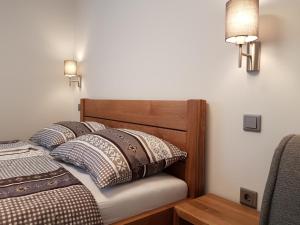 A bed or beds in a room at Apartments and Rooms Milena