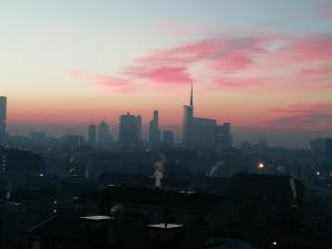 a view of a city skyline at sunset at Hotel Blaise & Francis in Milan