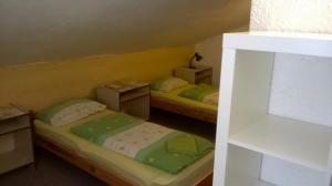 Posteľ alebo postele v izbe v ubytovaní Guest House Honzik