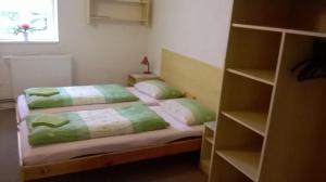 Posteľ alebo postele v izbe v ubytovaní Guest House Honzik