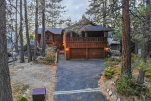 a house in the woods with a garage at Skyland Retreat - Max nighttime occupancy of 8 in Zephyr Cove