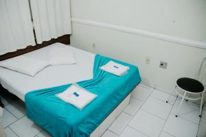 מיטה או מיטות בחדר ב-Hotel Lumem Taguatinga Sul