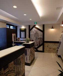 a bar in a restaurant with a stone wall at Amiral-Fondary in Paris