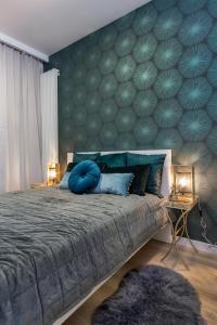 Posteľ alebo postele v izbe v ubytovaní Mennica Residence Chic Apartment