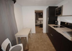 Kuchyň nebo kuchyňský kout v ubytování Apartment ILWA
