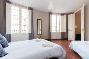 Postel nebo postele na pokoji v ubytování Key Barcelona HOUSING (Carrer Girona)