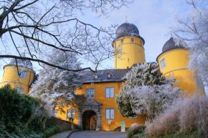 a castle with two domes on top of it at Casa Metzjersch in Gemünden