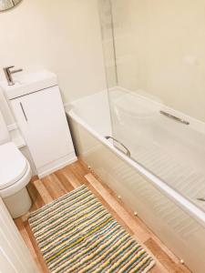 A bathroom at Wisteria Cottage