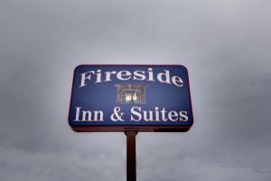 a sign for a friscide inn and suites at Fireside Inn and Suites in Devils Lake