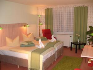 Кровать или кровати в номере Hotel Haufe