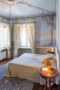 Postel nebo postele na pokoji v ubytování Hotel Alla Corte degli Angeli