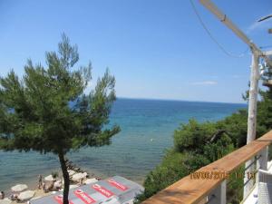a view of the beach from the balcony of a resort at Litsa 1 in Metamorfosi
