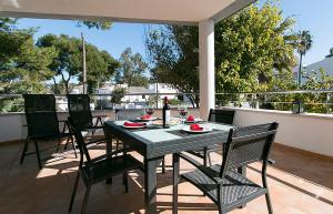 a table and chairs sitting on a patio at Villa Baladres in Alcudia